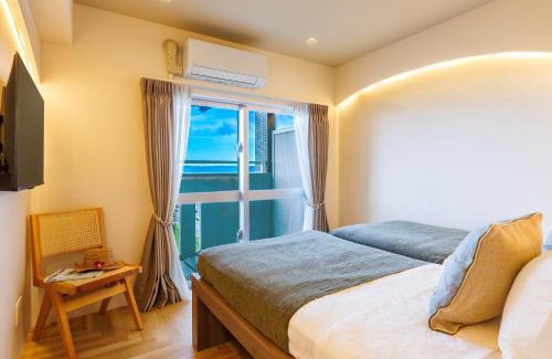 Yonabaru Apartment | オーシャンビュー窓から見える景色を想い出にThe琉球タワー10A