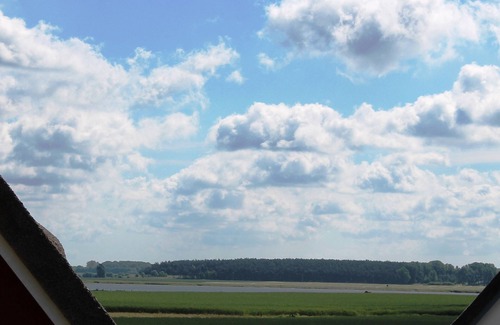 Ummanz House | 5 star vacation home close to the water, thatched roof, terrace, sauna, fireplace, WLAN, barbecue