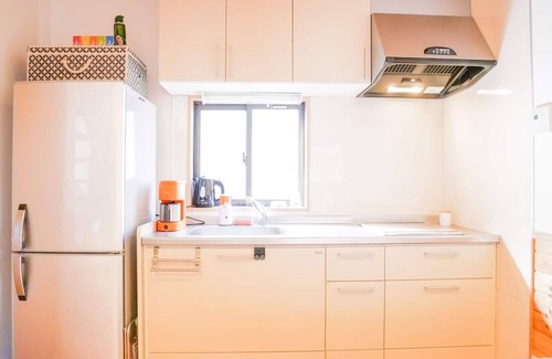 Shimotaga House | A spectacular view! Relax on the sea-view terrace/Scandinavian log house with hot spring & fireplace