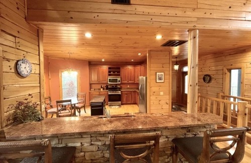 Tellico Plains Cabin | A true log cabin with 360 degree mountain views - Pet and Motorcycle friendly! 5 Bedroom Cabin by RedAwning