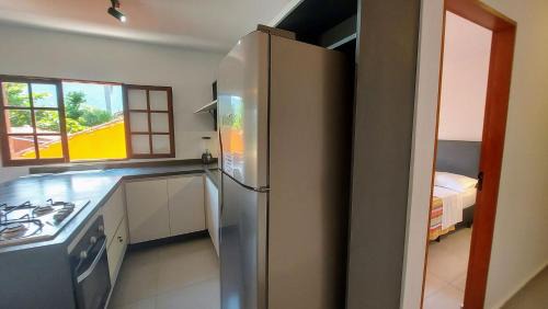 Jabaquara Apartment | Algodão - Novo Flat com Piscina, 50mts da praia, churrasqueira privativa, ar con, wi-fi, netflix, garagem