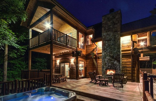 Almond Cabin | Antler Ridge - a stunning log cabin with spacious deck equipped with outdoor fireplace, hot tub, and scenic mountain views!
