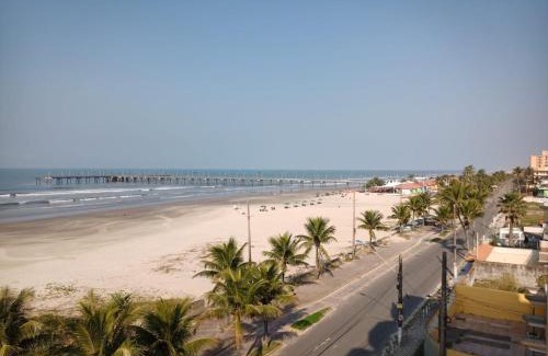 Mongagua Apartment | Apartamento pé na areia com sacada e garagem 2 banheiros