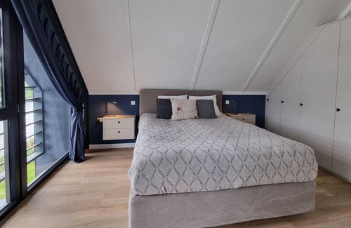 Balk House | Atmospheric sustainable villa in Balk with jetty