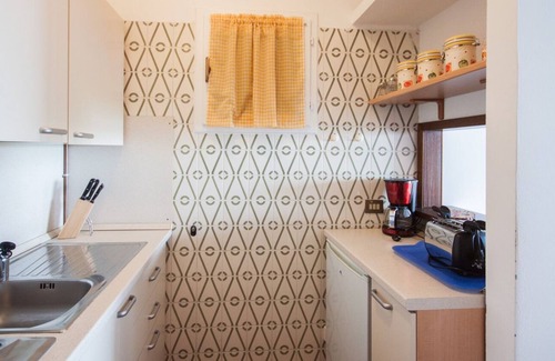 Susello Apartment | Attractive studio with terrace and garden, pool and dream view