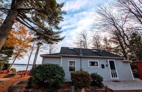 Sullivan House | Back of the Moon Lakefront Camp family watersports fire pit 1 dog beach sleeps 8