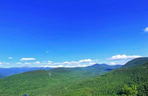 Bretton Woods Villa | BC Log cabin with private beach river fire pit AC wifi onsite trails ski slope views