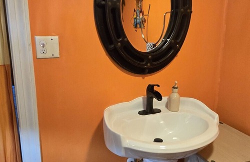 Hubert Hotel | Beach Suite minutes to beaches & base at The White House on Freedom Way 1 person