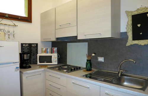 Brezzo di Bedero Apartment | Beautiful apartment for 4 people with pool, WIFI, TV, patio and pets allowed