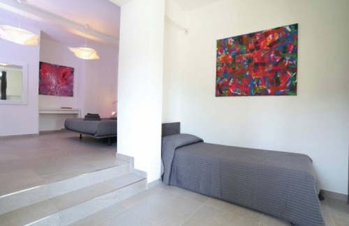 Palazzolo dello Stella Bed & Breakfast | Bed and Breakfast Loggia degli Artisti 'Deluxe Room Two' with Shared Pool and Air Conditioning