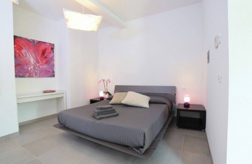 Palazzolo dello Stella Bed & Breakfast | Bed and Breakfast Loggia degli Artisti 'Quadruple Deluxe Room' with pool and air conditioning