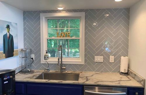 Lynn Center House | Best in QC! AweSpired Riverfront Retreat – Hot Tub, Fireplaces & Stunning Views!