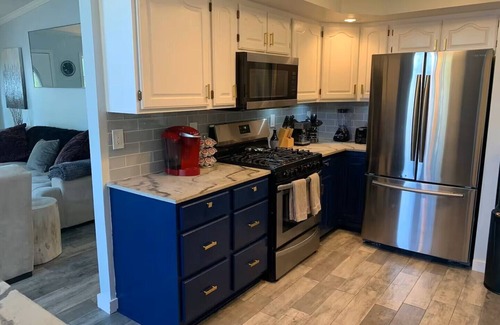 Lynn Center House | Best in QC! AweSpired Riverfront Retreat – Hot Tub, Fireplaces & Stunning Views!