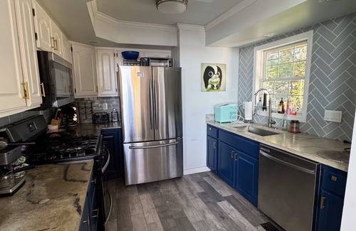 Lynn Center House | Best in QC! AweSpired Riverfront Retreat – Hot Tub, Fireplaces & Stunning Views!