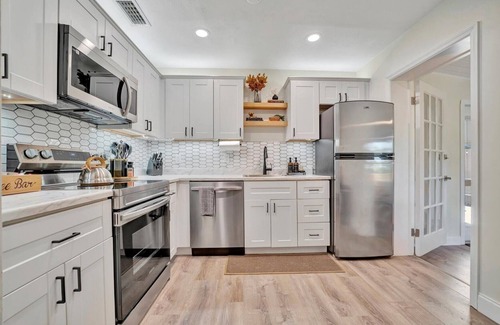 Sun Bay South House | Boho Oasis with Heated Pool, Billiards, Shuffleboard & More