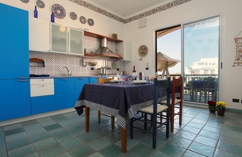 Marina di Ragusa Apartment | Bright apartment overlooking the beach and direct access to the sea