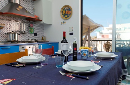 Marina di Ragusa Apartment | Bright apartment overlooking the beach and direct access to the sea