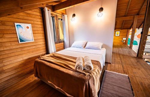 Vila Esperanca House | Cabana Perfeita a 800m da Praia - Lareira externa, Quintal Amplo, Pet Friendly, Ar condicionado, Netflix e Conforto completo