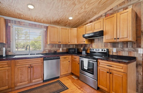 Rocky Point Cabin | Cabin sleeps 10 on 65 acres - dirt bike tracks, 4 wheel, fish, camp, and more!