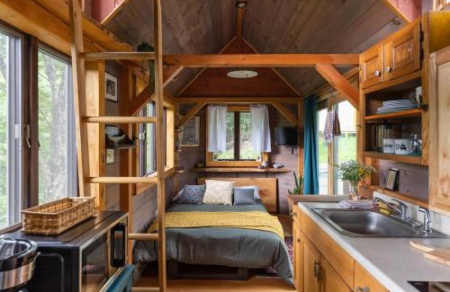 Johnson House | Caboose Tiny Home on river with hot tub near Stowe