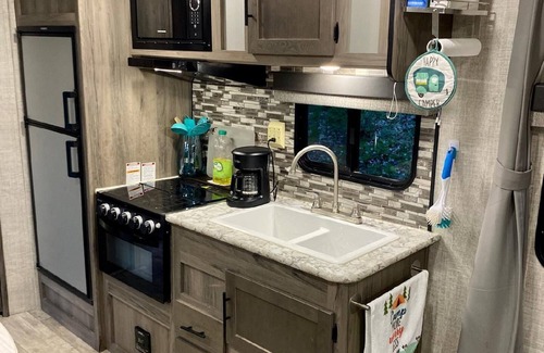 Decorah House | Camper next to a waterfall!