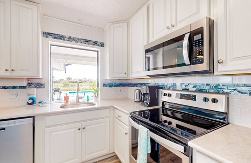 Pebble Beach House | Canal-front home with private pool, grill, patio, AC, W/D & gorgeous views