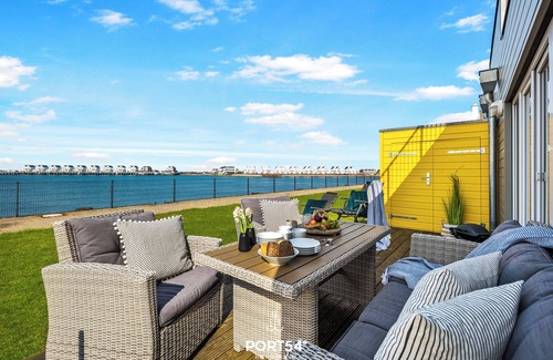 Olpenitz Apartment | Carpe Diem - directly on the water, terrace, bathtub, infrared sauna, washing machine