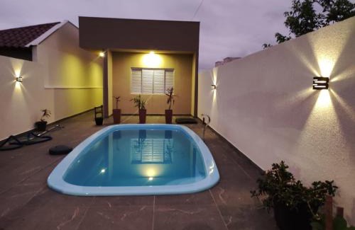 Guaratuba House | Casa com piscina , ar condicionado e churrasqueira no balneário Eliana