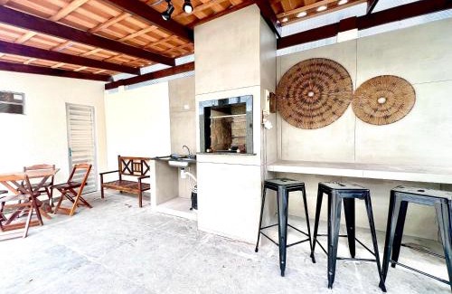 Guaratuba House | Casa com piscina , ar condicionado e churrasqueira no balneário Eliana