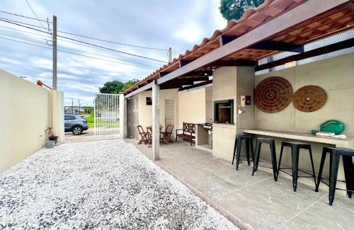 Guaratuba House | Casa com piscina , ar condicionado e churrasqueira no balneário Eliana