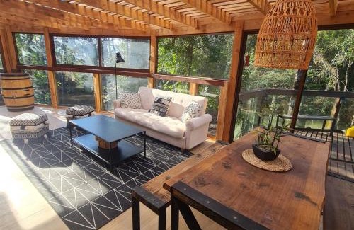 Pucon House | CASA CON TINAJA, PISCINA Y QUINCHO - Pucón