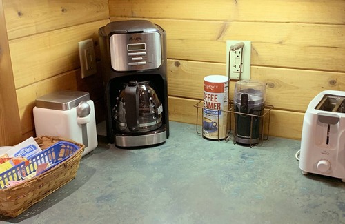 Ashford Cabin | Cedar cabin at Mt Rainier is custom built with queen bedroom and Murphy bed in the living room. Full kitchen. Spacious front porch with picnic tables and BBQ. Perfect for romance or bring the kids. Private hot tub in woodland setting. Walk to Copper