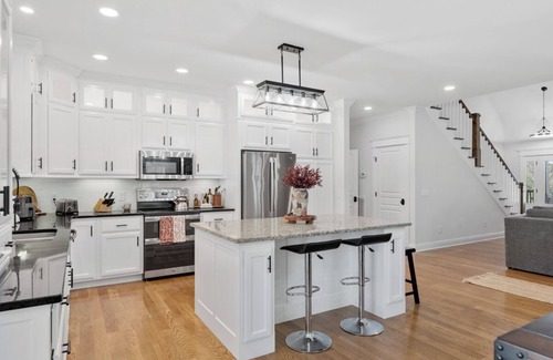 Bethpage House | Charming 3 bed, 2.5 bath farmhouse with hot tub, firepit, and seasonal pool!