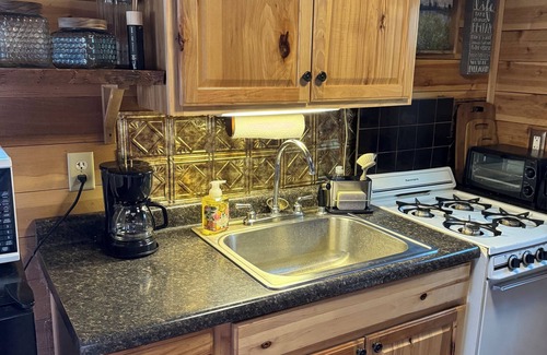 Kerrick Cabin | Charming cabin in delightful Duquette with AC near miles of ATV trails.