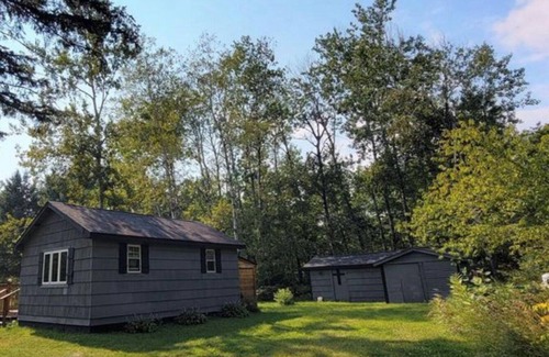 Kerrick Cabin | Charming cabin in delightful Duquette with AC near miles of ATV trails.