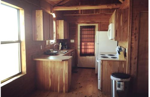 Prairie Lea House | Charming Log Cabin in Texas - Perfect Glamping Vacation on the San Marcos River near Kingsbury