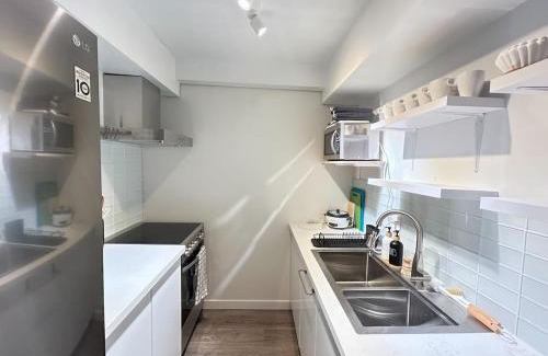 Riley Park Apartment | Charming Main Street Suite with Parking for 6 Guests