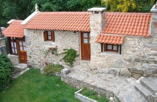 Poio Cottage | Charming traditional stone cottage nestled in the woods minutes from coast