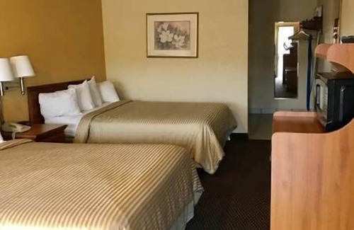 Magnolia Hotel | Coachman's Inn