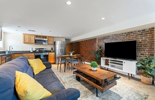 Columbia Heights House | Cozy 2 bedroom/1.5 bathroom English basement townhome. Spacious, safe, and family-friendly with open kitchen, dining area, and crib. Easy access to shops, restaurants, and DC attractions.