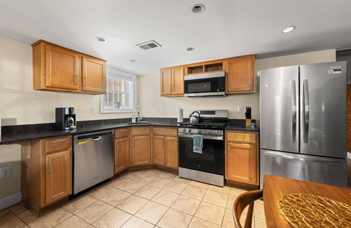 Columbia Heights House | Cozy 2 bedroom/1.5 bathroom English basement townhome. Spacious, safe, and family-friendly with open kitchen, dining area, and crib. Easy access to shops, restaurants, and DC attractions.