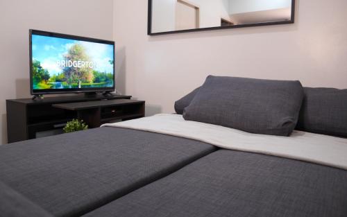 New Manila Apartment | Cozy 2BR Condo with Parking