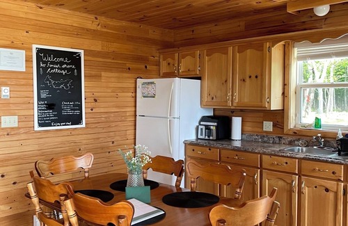 Borden-Carleton Cottage | Cozy cabin style cottage tucked into the woods with a view of the water.