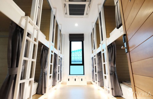 Lak Si Hotel | Cozy Capsule Dorms With a Shared Kitchen and a Social Area