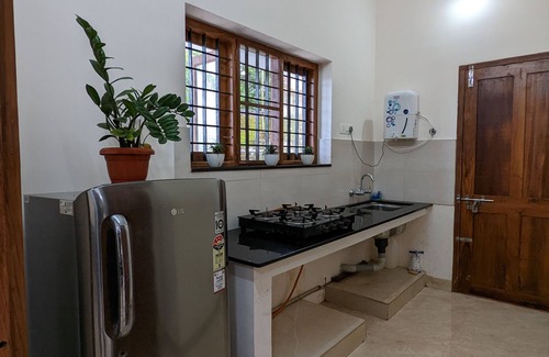 Irinjalakuda Villa | Cozy One Bedroom Villa Facing Paddy fields amidst a Fruit garden