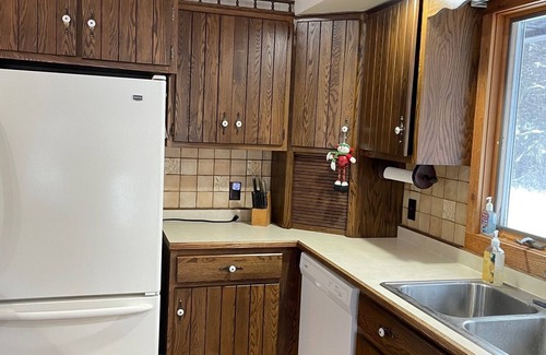 Deerton Cabin | Cozy Welcoming Laughing Whitefish River Cabin Ready For Your Visit