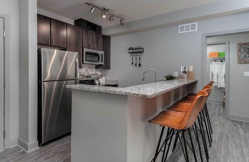 Central Business District Apartment | CozySuites at the Banks gym, pool 15