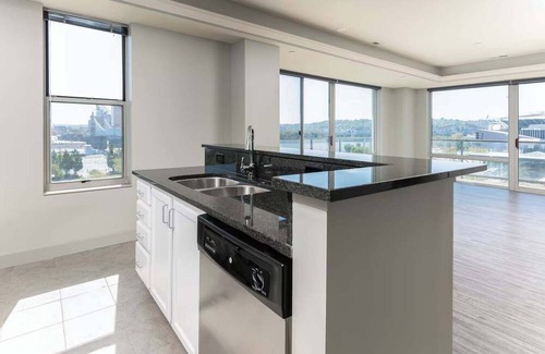 Central Business District Apartment | CozySuites at the Banks gym, pool 15