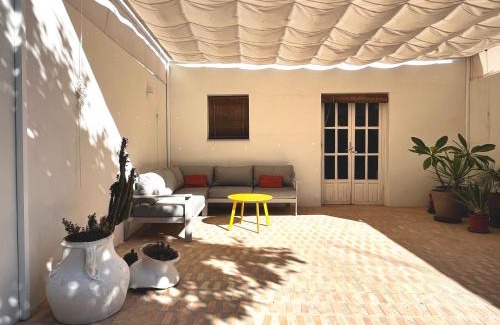 Carrion De Los Cespedes Apartment | Design & art, patio with orange tree, near Seville
