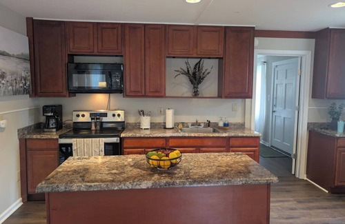 Cave Spring Cabin | Dockside Dreams at Rivers Edge Retreat – 2 bd/1ba Waterfront home on the Coosa River at Lake Weiss (GA/AL line). This updated, newly renovated ranch-style home offers the perfect setting to unplug, recharge and make wonderful lifetime memories!